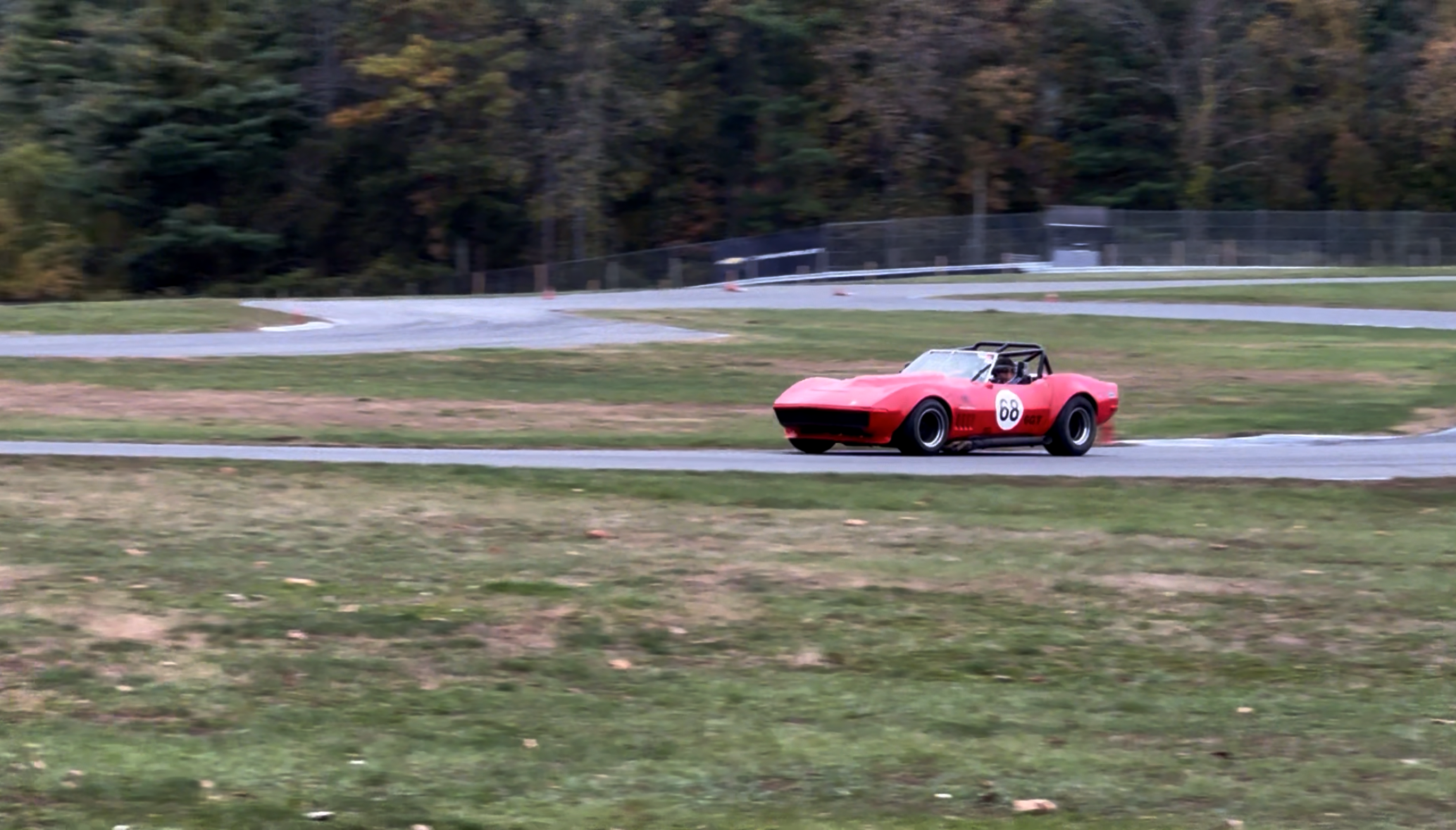 Turn 5 overlay showing ideal (green) vs current (orange) line with speed and lateral-G traces.